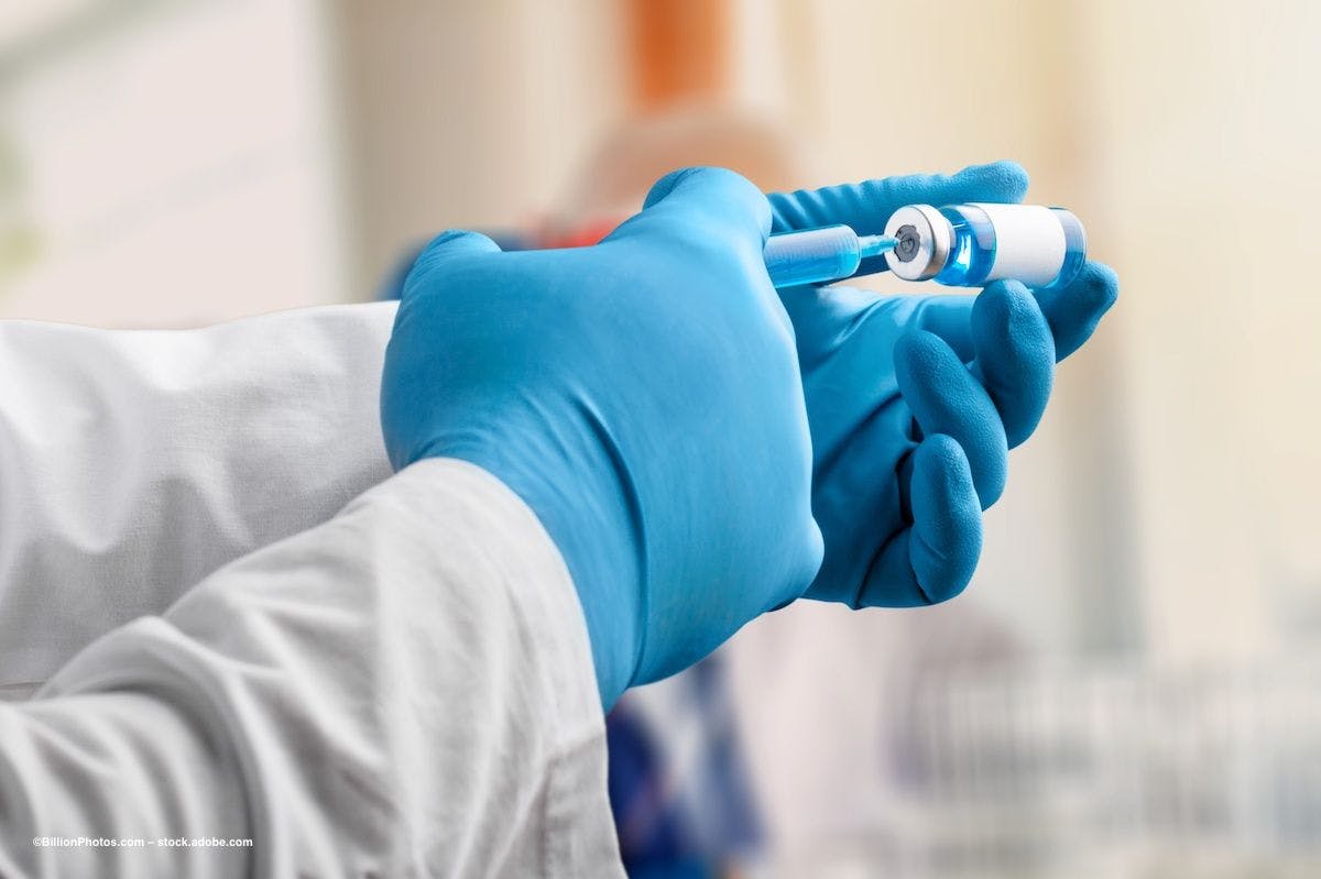 A gloved hand fills a syringe with an injectable drug. Image credit: ©BillionPhotos.com – stock.adobe.com