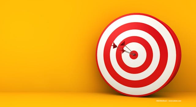 Arrows hit a target on a yellow background. Image credit: ©MclittleStock – stock.adobe.com