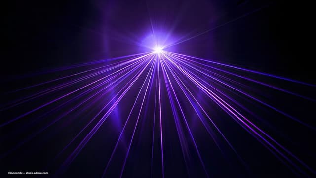 A collection of purple lasers shoot from a central light source. Image credit: ©monsifdx – stock.adobe.com