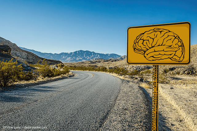 A road sign with a brain on it in front of a highway. Image credit: ©Prime Lens – stock.adobe.com