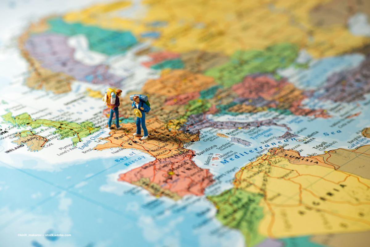 Miniature figures with backpacks stand on a map of Europe. Image credit: ©kirill_makarov – stock.adobe.com