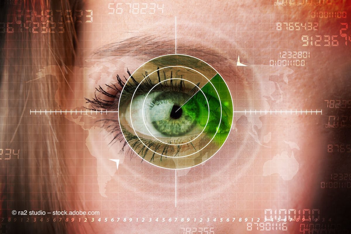 A green eye looks out underneath a digital interface of a target. Image credit: © ra2 studio – stock.adobe.com
