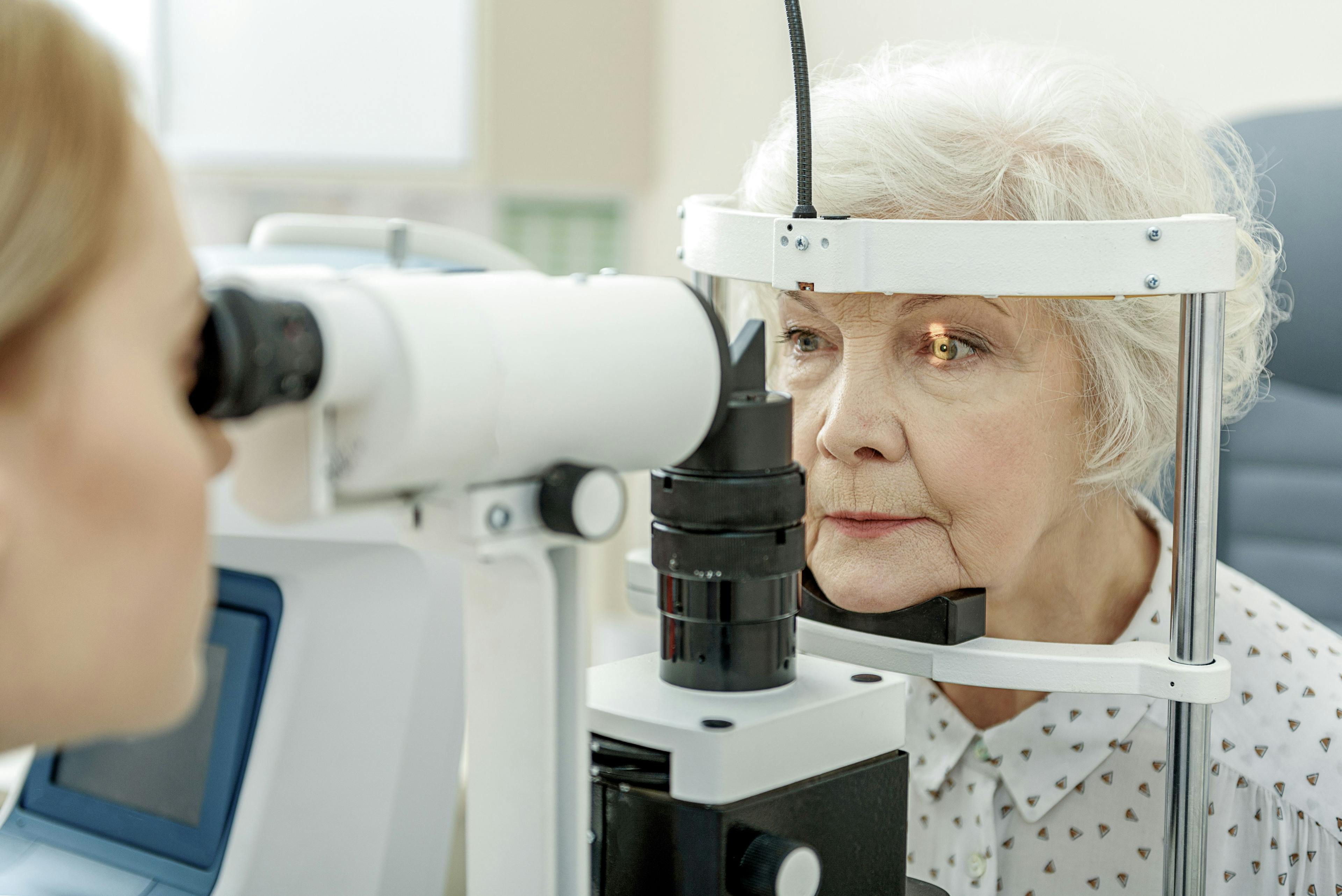 slit lamp eye exam on older woman