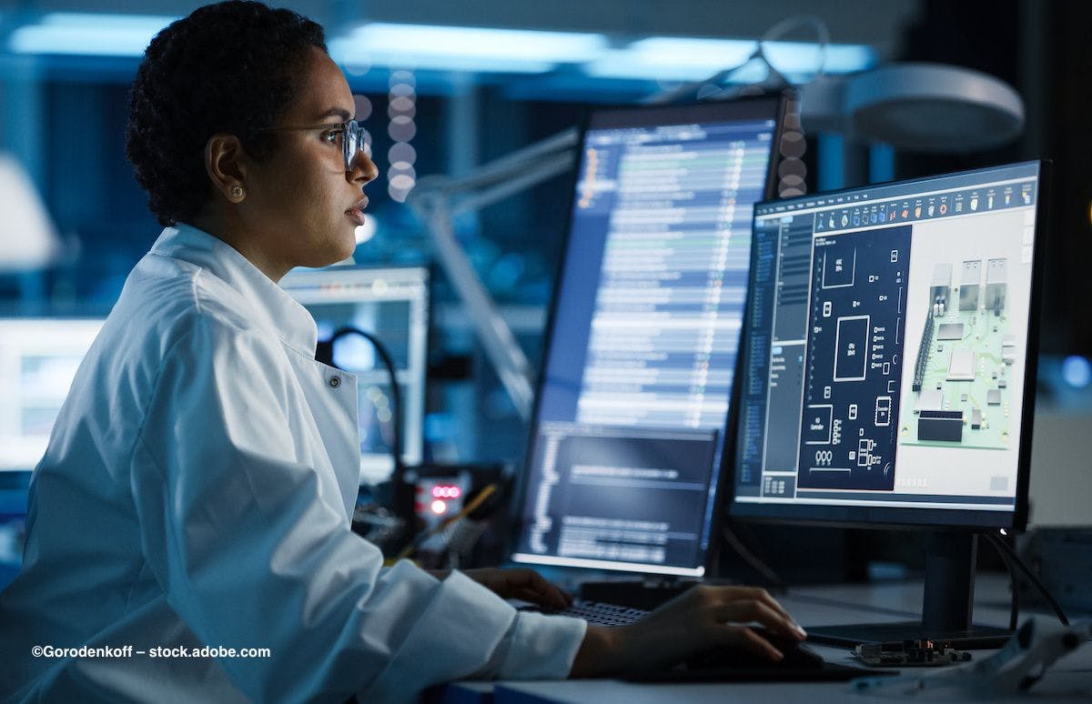 A scientist sits at a computer, reviewing data on the screen. Image credit: ©Gorodenkoff – stock.adobe.com