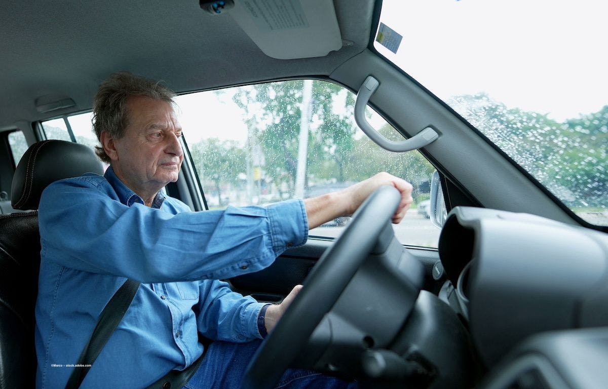 A man drives in cloudy conditions. Image credit: ©Marco – stock.adobe.com