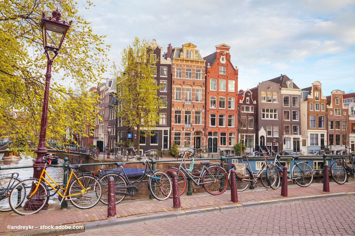 A bridge and bicycles in Amsterdam. Image credit: ©andreykr – stock.adobe.com