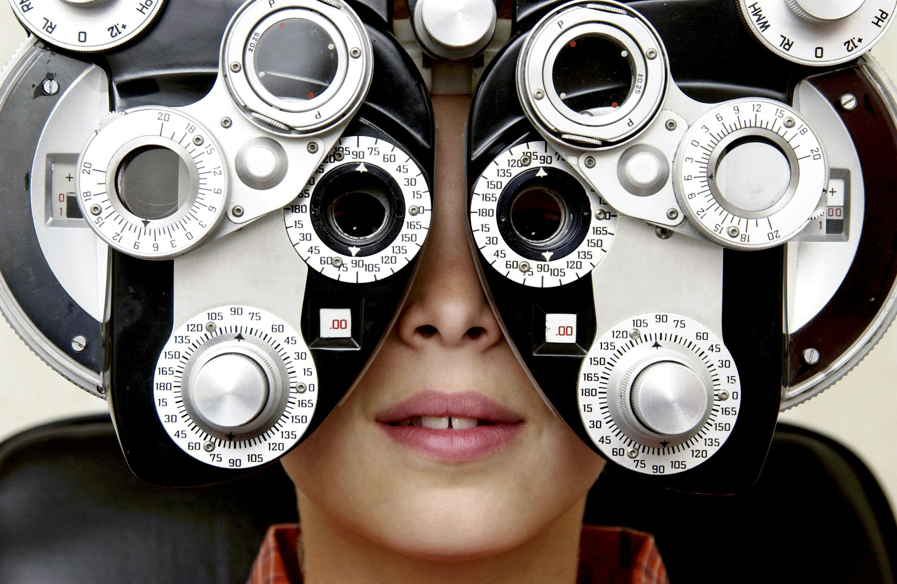 young boy getting eye exam for vision correction