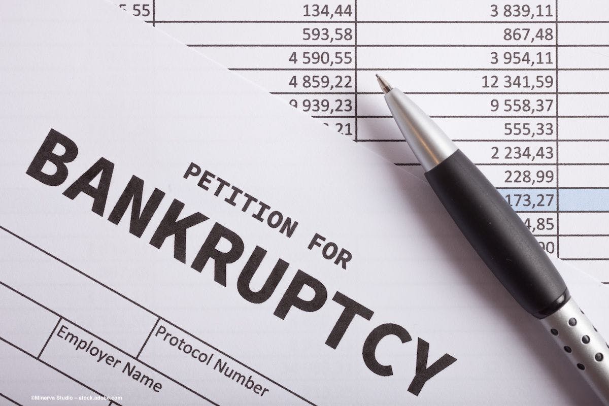 Documents indicate a corporation filing for bankruptcy. Image credit: ©Minerva Studio – stock.adobe.com