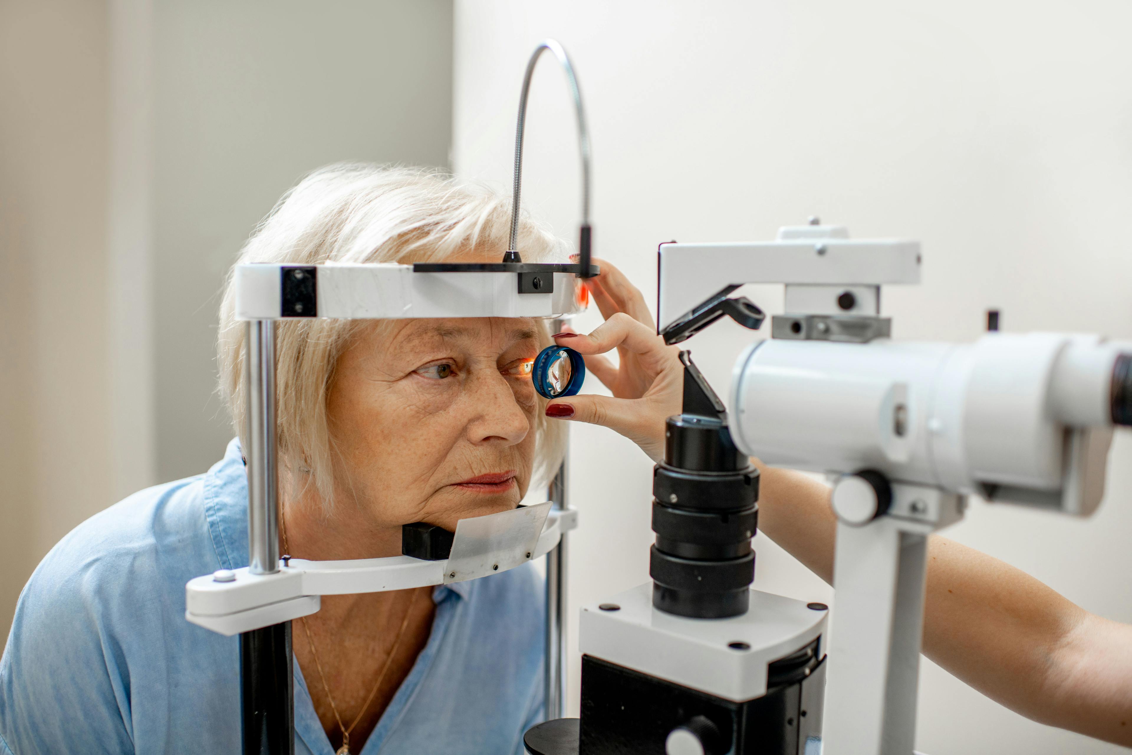 Eye exam on elderly woman
