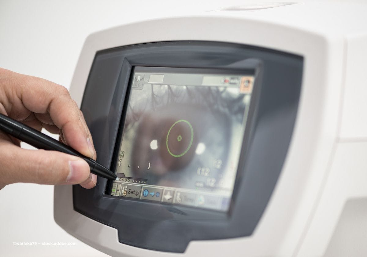 A physician uses a stylus to look at the image of a cornea. Image credit: ©warloka79 – stock.adobe.com