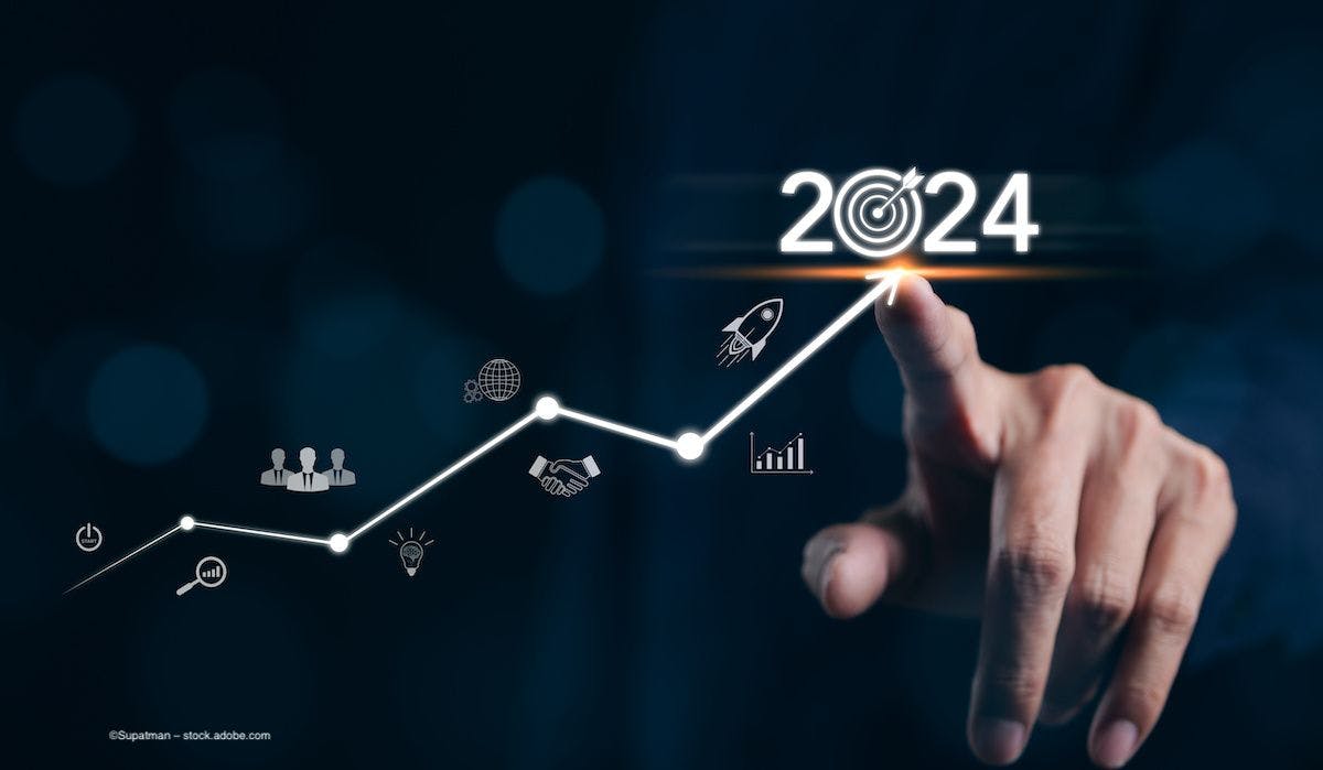 A person points at a digital interface which shows a line graph leading to peak performance in 2024. Image credit: ©Supatman – stock.adobe.com