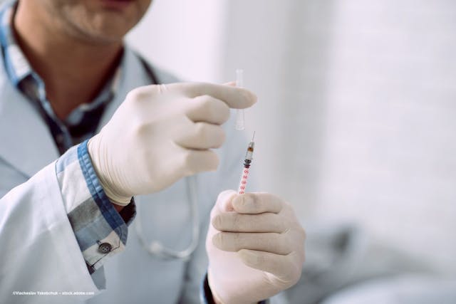 A physician prepares a syringe for injection. Image credit: ©Viacheslav Yakobchuk – stock.adobe.com