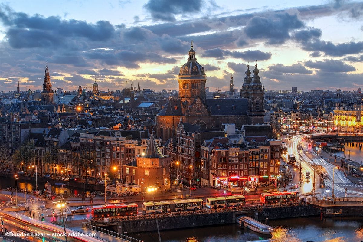 A view of Amsterdam, the Netherlands, at night. Image credit: ©Bogdan Lazar – stock.adobe.com