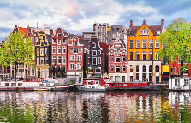 A row of houses in historic Amsterdam.  Image Credit: ©Yasonya – stock.adobe.com